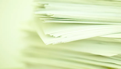 Close-up of a stack of white printer paper.